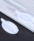Four Pack Peel And Stick Drawer Pulls Easy Grip Handles For Cabinets And Doors No Glue Needed Self Adhesive White 1.9 By 3.2 Inches Fits Glass Tile Stainless Steel Wood Surfaces. White ABS self-adhesive drawer pull on cabinet door