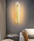 Hella Smooth Game Changing Geometric LED Wall Sconce With Dope Phoenix Tail Design And Acrylic Shade in soft illumination beside a sofa.