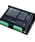 Front view of DM556 CNC digital stepper driver with two green screw-terminal blocks.