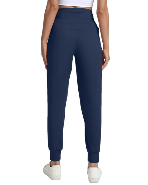 Back view of navy blue fleece lined womens joggers with zip pockets high waist athletic pants for travel lounge and workout plus size 3XL.