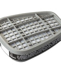 Close-up of Organic Vapor Cartridge 6001 2 Pack for Respirators, showing replacement filter for paint fumes and solvents.