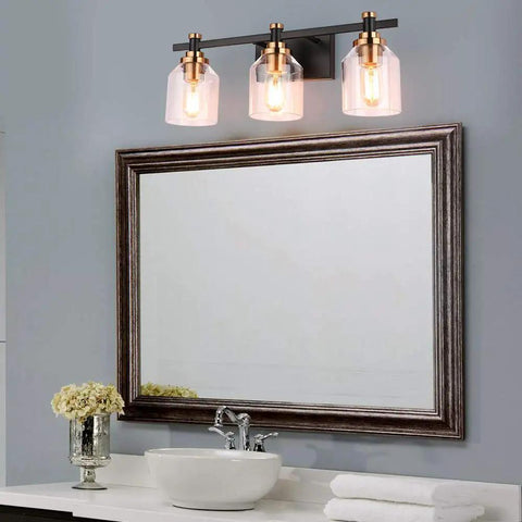 Three Light Industrial Bathroom Vanity Sconce With Black Gold Finish Matte Black Brushed Gold Copper Accent Socket Clear Glass Shade Sleek Dope Modern Farmhouse Bath Lighting above mirror