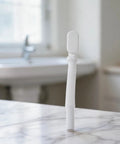 G1-1/2 Flat Bathtub Drain Pipe Kit Flexible Waste Pipe for Freestanding Tub Low Profile P-Trap White 92cm on marble surface.