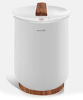 White bucket style towel warmer with wood accents, for keeping towels toasty in the bathroom and spa at home with auto shut off.