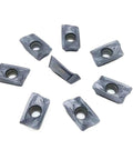 Durable Indexable Carbide Lathe Tool R390 11T308 PM For Turning Steel And Stainless. Eight gray metal cutting inserts.