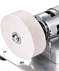 Close-up of Compact No Fuss Mini Bench Grinder With A 2 76 Inch Wheel and Vibration Dampening Base showing 2.76 inch wheel and motor.