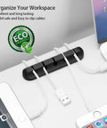 Self Adhesive Cable Clip Organizer Set For Desk, Car, Nightstand And Office Silicone Cord Holders With 7 5 3 1 1 Slots, Grab-And-Go Wire Clips For Phone Chargers, Black visible in action on a desk.