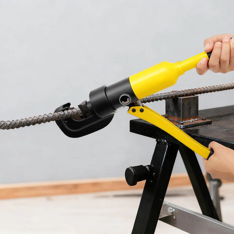 Heavy Duty 22mm Hydraulic Rebar Cutter With Sturdy Steel Toolbox For Construction Sites cutting through steel rod on a workbench.