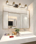 Upgrade Your Bathroom Vanity With Industrial Four Light Fixture In Vintage Black And Brass Finish With Clear Glass Globes