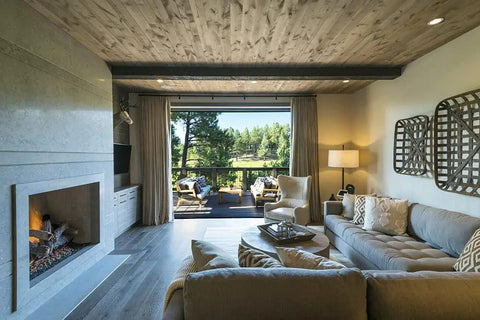 No Brainer Walnut Aging Wood Stain In 5 Gallon Pails used on rough cut lumber in a modern rustic interior with a fireplace.
