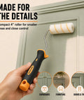 Top Shelf DIY Home Improvement Paint Roller Kit With Wired Cage Trays Sturdy Angled Brushes Nine And Four Inch Rollers Heavy Duty Masking Tape And Mixing Wand For Buttery Smooth Walls, close-up of 4 inch roller applying paint.