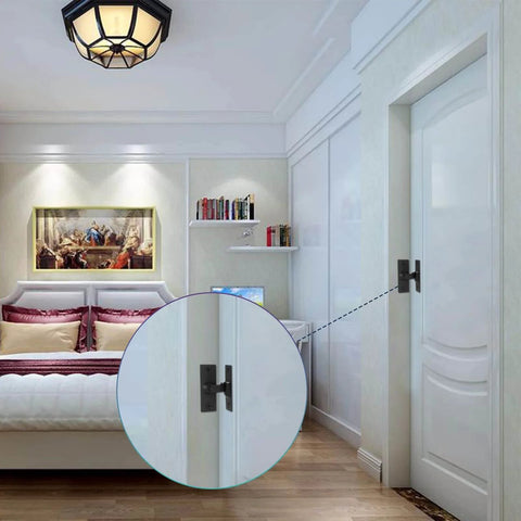 Stainless Steel 90 Degree Right Angle Sliding Door Lock for Barn Doors installed on a white door, matte black finish