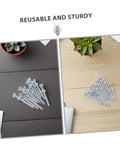 Heavy Duty Lawn Aerator Shoes With Metal Peg Spikes 12 pairs displayed on black and wood surfaces with succulents