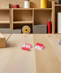 Peel And Stick Clear Acrylic Cabinet Hinges 80 Pack No Drill Install with red tops on wooden floor