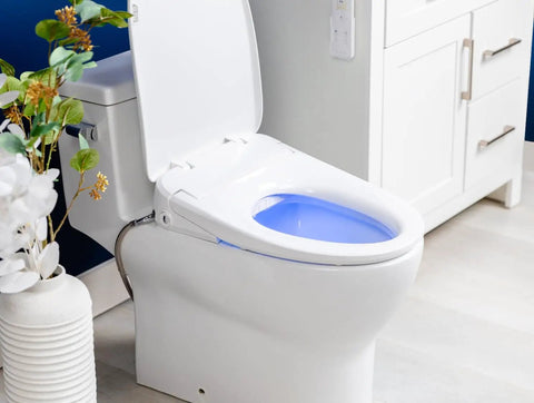 Top Shelf Elongated Bidet Toilet Seat Crisp White with LED nightlight and adjustable nozzle in modern bathroom setting.