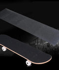 Non Slip Grip Tape Sheet For Skateboard And Longboard, 10.6 X 43.3 Inches, shown with skateboard, black sandpaper surface.