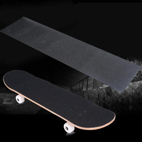 Non Slip Grip Tape Sheet For Skateboard And Longboard, 10.6 X 43.3 Inches, shown with skateboard, black sandpaper surface.