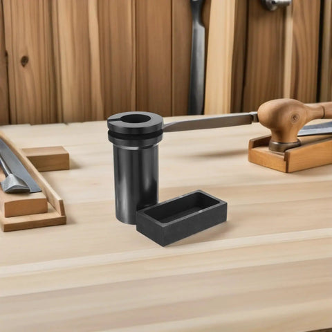 Heavy Lifter Graphite Crucible And Metal Smelting Mold Set With Integrated Oil Traps for seamless casting on workbench.