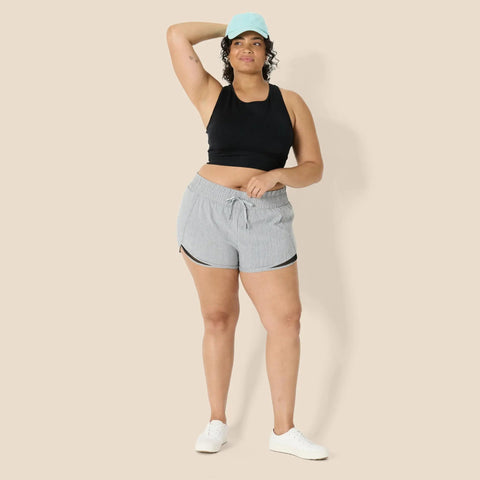 Model wearing Women's Regular Fit Athletic Woven Running Shorts With Ruched Waistband, Zip Pocket, Breathable Lightweight Fabric, Gray Heather, Size Medium