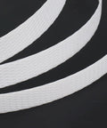 Heavy Duty Polypropylene Strapping Roll Six Thousand Feet Half Inch Wide Point Zero Three Thick Three Hundred Pound Break Strength Standard Core on black background