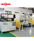 Front view of WinWin WW60JET waterjet cutting system with robotic arms and yellow safety enclosures