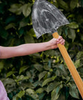Child holding one piece of Two Piece Foam Pickaxe And Shovel Props For Mine Cosplay Party Decor Lightweight Plastic And Sponge Stage Props Dope Photo Op Props Safe Realistic Look For Fun Themed Events.