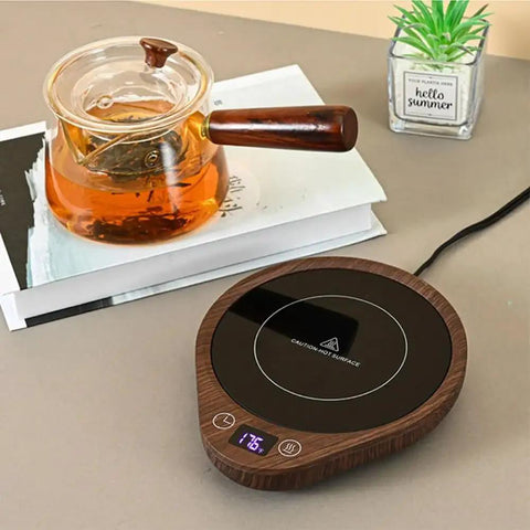 Keep Your Daily Drip Stayin Toasty With This Electric Coffee Mug Warmer Featuring Three Custom Temperature Levels Four Hour Auto Shut Off And Compact Desk Base For Zero Cold Sip Regrets. Desk electric mug warmer with LCD display and flat surface.