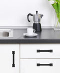 Kitchen with 10 Pack Matte Black 5 Inch 128mm Cabinet Handles Zinc Alloy Drawer Pulls installed on white cabinets and drawers.