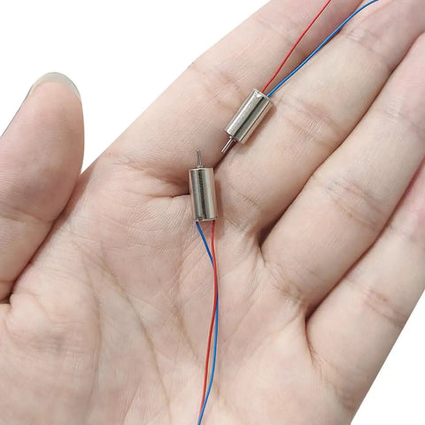 Two Pack Tiny But Mighty Coreless DC Motor 1.5V To 3.7V 40,000 RPM 6mm By 12mm Micro Motor in hand, showcasing size and wiring