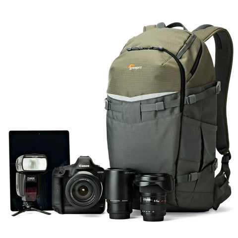 Flipside Trek BP 450 AW Camera Backpack With All Weather Cover, grey and dark green, beside camera and lenses, front view.