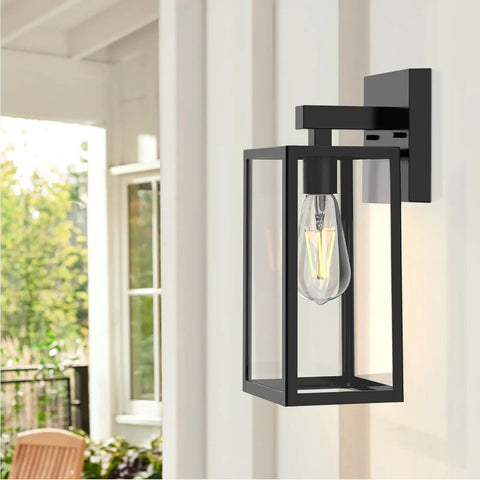 Durable Black Exterior Wall Lanterns With Hella Weatherproof Build For Backyards And Patios mounted on a wall with clear glass.