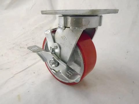 Heavy Duty Caster Set Featuring 5 Inch Polyurethane Wheels On Steel Core Kingpinless Swivel With Top Lock Brake Plus Two Rigid Mounts Smooth Rollin Ride For Custom Toolboxes, close-up view of swivel wheel with brake.