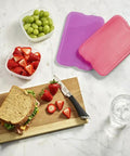 Slim Reusable Gel Ice Packs Set Of 8 Bpa Free Space Saving Cooler Block Quick Freeze Flexible Fit in colorful containers with food.