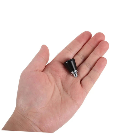 Heavy Duty 4 Pc Set Black Mechanical Spring Pins in a hand, showcasing anti-vibration design for workshop use.