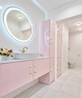 Modern bathroom with pink cabinets featuring 2 Pack 5 Inch Self Stick Cabinet Handles With Adhesive Gold Metal Drawer Pulls installed.