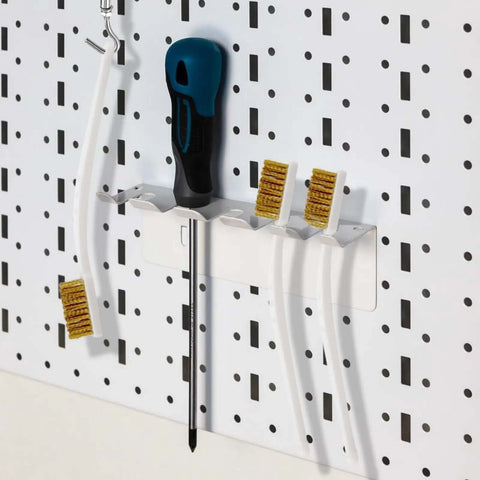 Pro Grade Three Pack Brass Wire Brush Set For 3D Printer Nozzle Cleaning on a pegboard, showing curved handles and brass bristles
