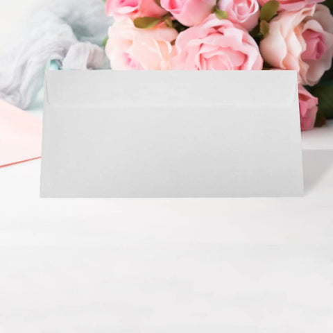 White Self Seal Confidentiality Envelopes 115mm By 225mm for office use, displayed with floral background