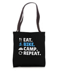 Gravel Bikepacking Tote Bag For Eat Bike Camp Repeat Adventure Lovers With 16x16 Inch Lightweight Polyester Canvas Dual 14 Inch Black Webbing Handles Trail Ready displaying "Eat. Bike. Camp. Repeat." design