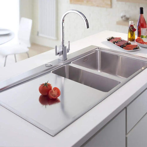 Modern kitchen with polished stainless steel sink and faucet, featuring a Sink Top Air Switch Kit for garbage disposal on counter.