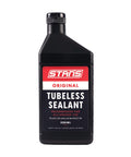 Black bottle of Ultra Fast Tubeless Tire Sealant For Bikes That Seals Punctures Up To Six Point Five Millimeters And Is Long Lasting