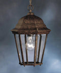 Madison Outdoor Pendant Light 1 Light In Tannery Bronze With Clear Beveled Glass For Damp Outdoor Locations Lit Classic Colonial Style Exterior Fixture Pro showing colonial lantern design against blue background.