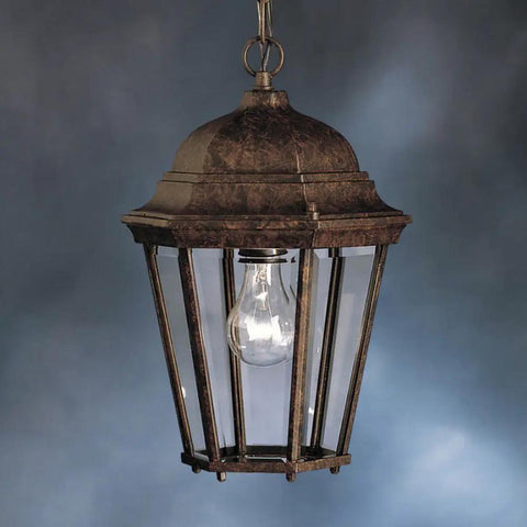 Madison Outdoor Pendant Light 1 Light In Tannery Bronze With Clear Beveled Glass For Damp Outdoor Locations Lit Classic Colonial Style Exterior Fixture Pro showing colonial lantern design against blue background.