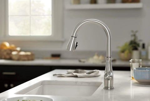 Elmhurst Pull Down Sprayer Kitchen Faucet in brushed nickel installed on a single-hole sink in a modern kitchen.