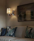 Solid Brass Wall Sconces With Glass Lantern, stylish light fixture illuminating a cozy living room corner.
