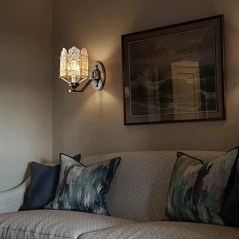 Solid Brass Wall Sconces With Glass Lantern, stylish light fixture illuminating a cozy living room corner.