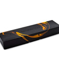 Nespresso coffee capsule box with black and orange design, rectangular, packaging for Nespresso machines.