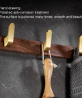Straight Up Sturdy Five Hook Wall Coat Rack designed for hanging daily duds, hats, keys, and towels, showing polished gold hooks on wood.