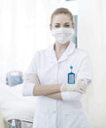 Nurse wearing white uniform with a blue card holder from 20 Pieces PU Leather Badge Reel Card Holders Set With Retractable Reels And Durable Metal Clip