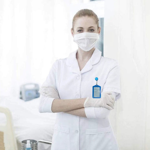 Nurse wearing white uniform with a blue card holder from 20 Pieces PU Leather Badge Reel Card Holders Set With Retractable Reels And Durable Metal Clip