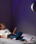 Child using Moon In My Room Light Up Lunar Phases Kit With Remote Control Or Automatic Mode STEM Toy For Kids Ages 6 And Up